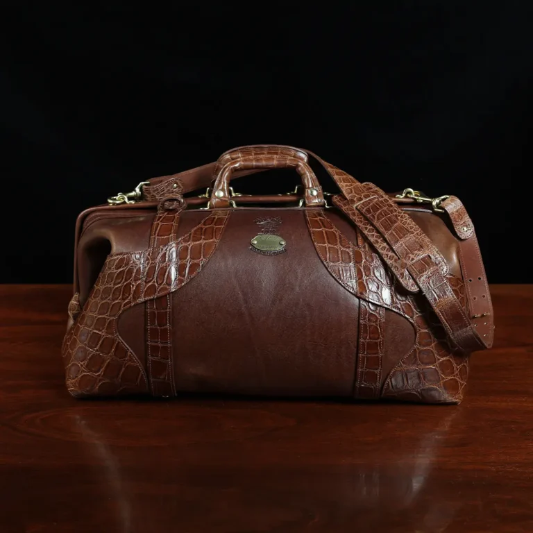 no 5 grip in steerhide with brown american alligator trim - front view - on a wood table with black background - ID 003