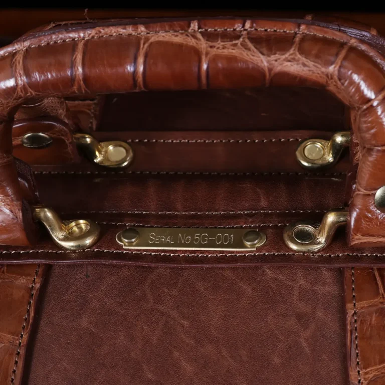 no 5 grip in steerhide with brown american alligator trim - serial number view - on a wood table with black background - ID 001