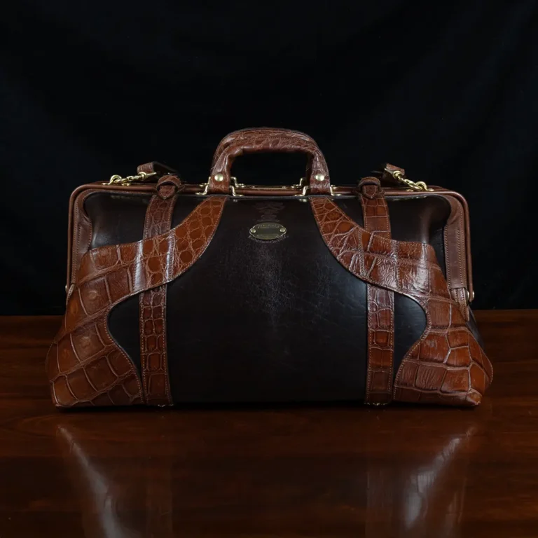 no 5 grip in tobacco buffalo with brown american alligator trim - front view - on a wood table with black background - ID 008