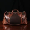 no 5 grip in tobacco buffalo with brown american alligator trim - back view - on a wood table with black background - ID 001