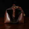 no 5 grip in tobacco buffalo with brown american alligator trim - side view - on a wood table with black background - ID 001