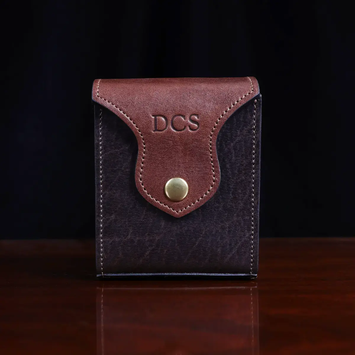 Leather playing card case, hold two decks of playing cards. showing the front view