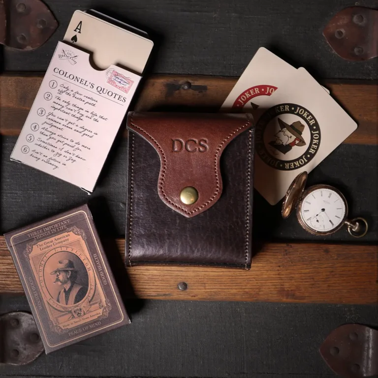 Leather playing card case, hold two decks of playing cards. showing the front view - with two decks of cards and pocket watch