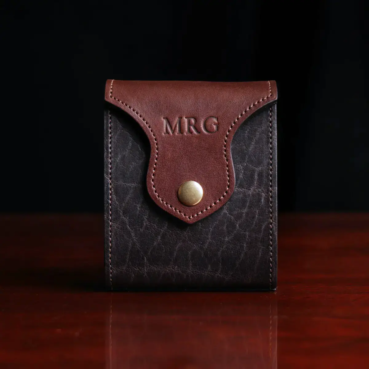 Leather playing card case, hold one deck of playing cards. showing the front view