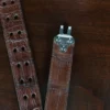 An American Alligator Belt with Nickel hardware showing the open hook view on a wooden table with black background - id 002
