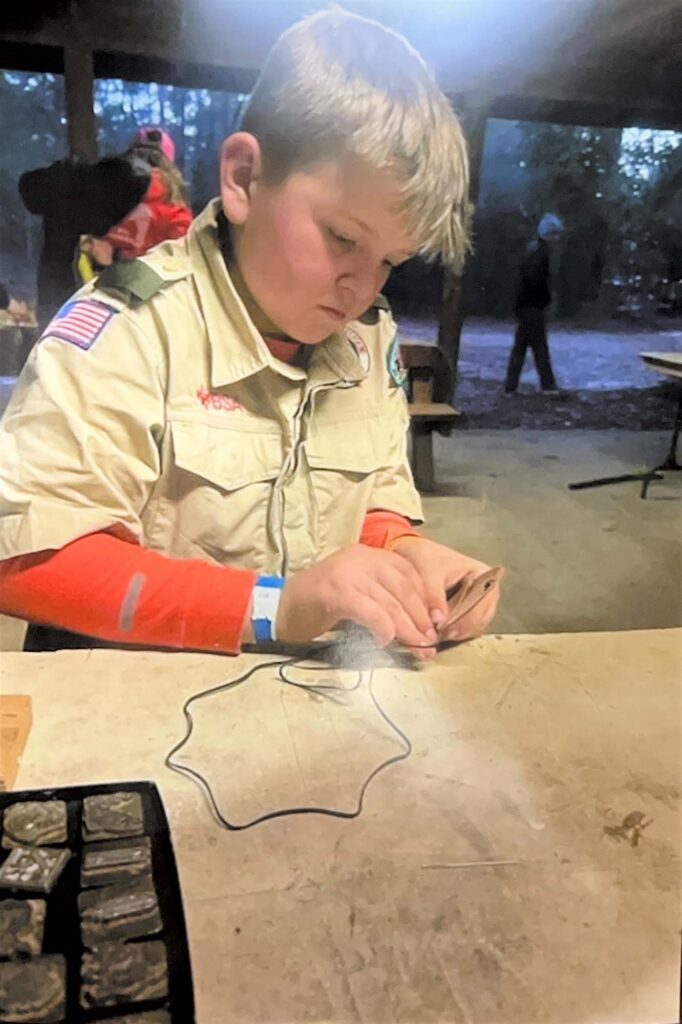 A Letter From a Boy Scout 6 mashall working on leather project