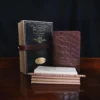 No. 27 Pocket Journal in Vintage Brown American Alligator - ID 002 - front view, shown with journal register archive box, 2 journal register notebooks, a stack of cream index notecards, and a Col. Littleton wooden No. 2 pencil