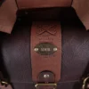 leather no 1 grip travel bag in tobacco brown american buffalo showing the brass plate