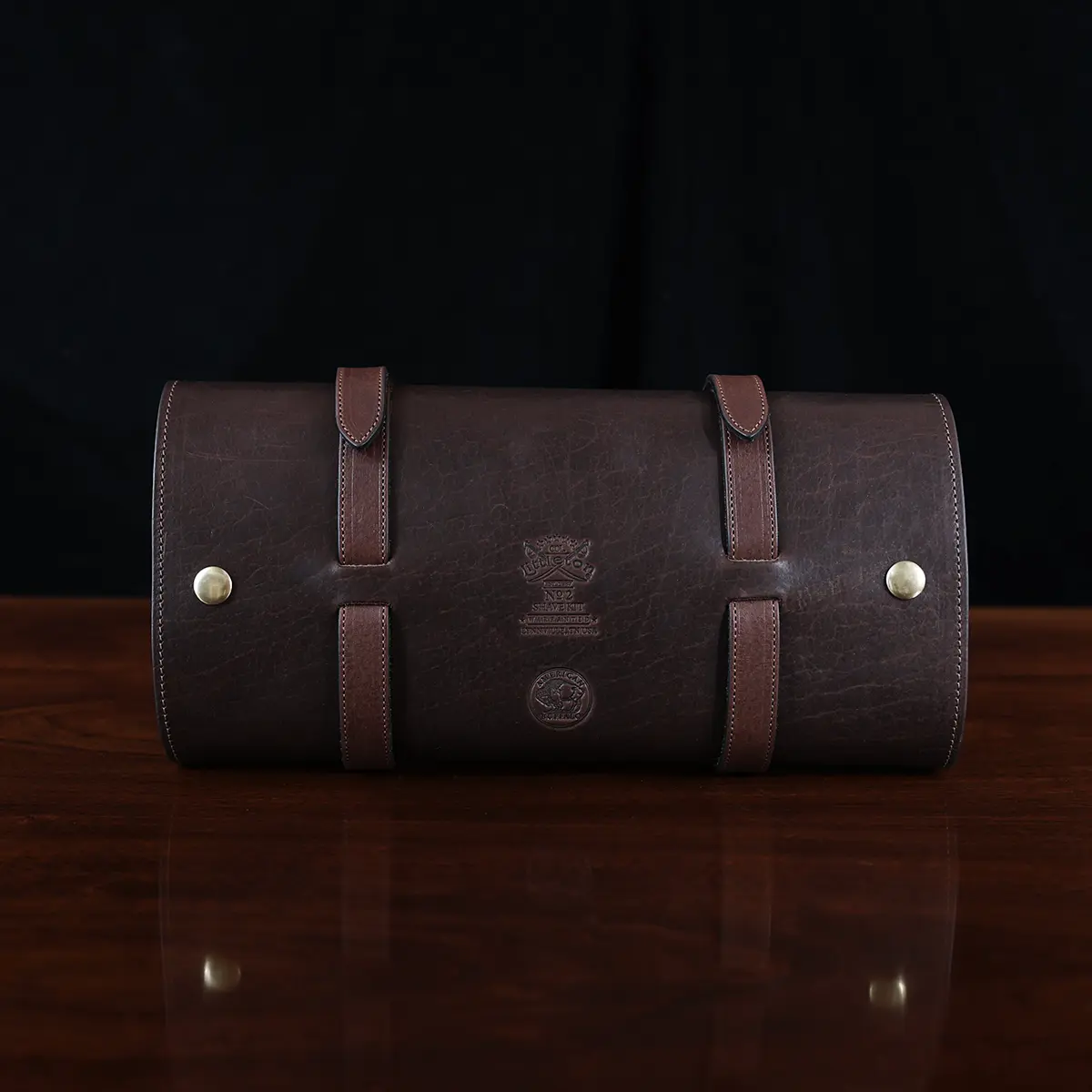 No. 2 Shave Dopp Kit in tobacco buffalo with No. 8 Khaki Cotton Canvas Lining - back view on a wooden table