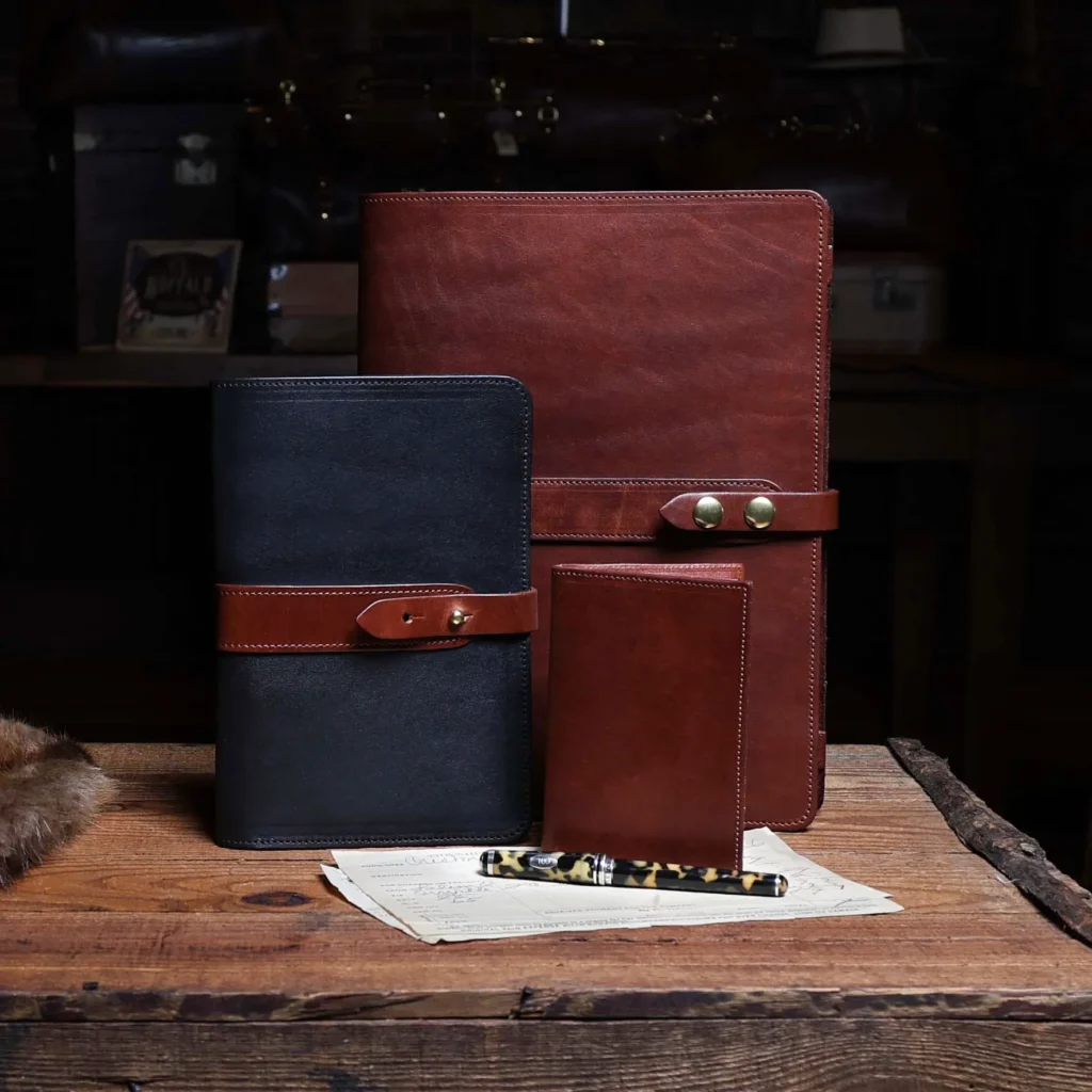 portfolios and journals sitting on a old wooden chest