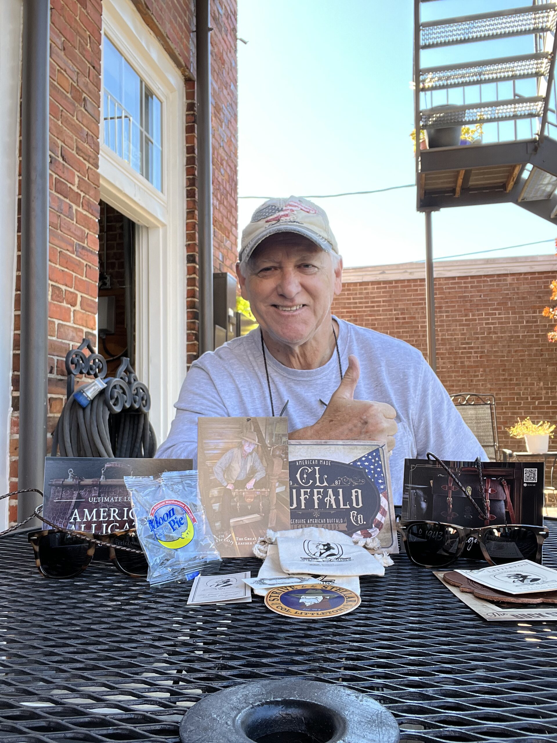 a customer with his colonel littleton products
