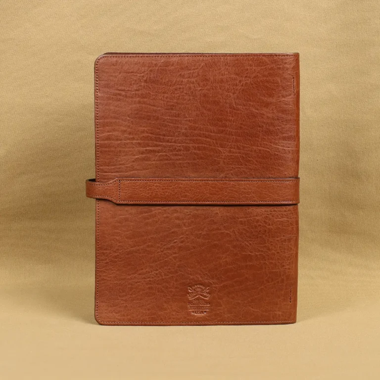 Rugged leather portfolio showing the back with brass hardware.