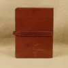 Rugged leather portfolio showing the front with brass hardware - back view