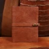 Rugged leather portfolio showing the front with brass hardware.