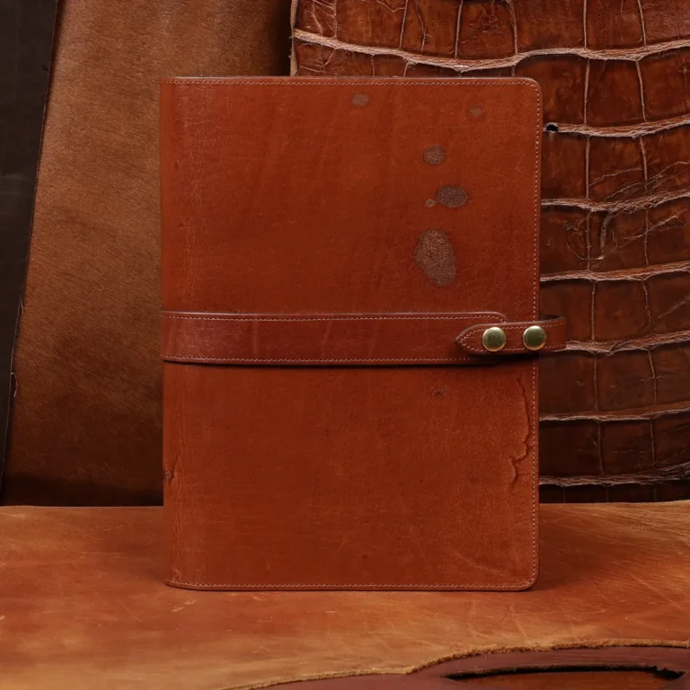 Rugged leather portfolio showing the front with brass hardware.