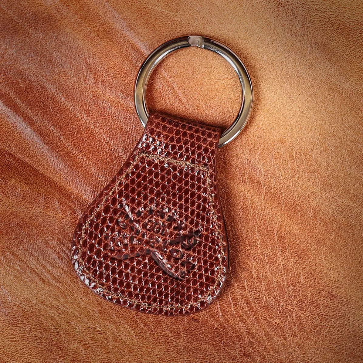 View larger image of back side of a brown lizard key ring