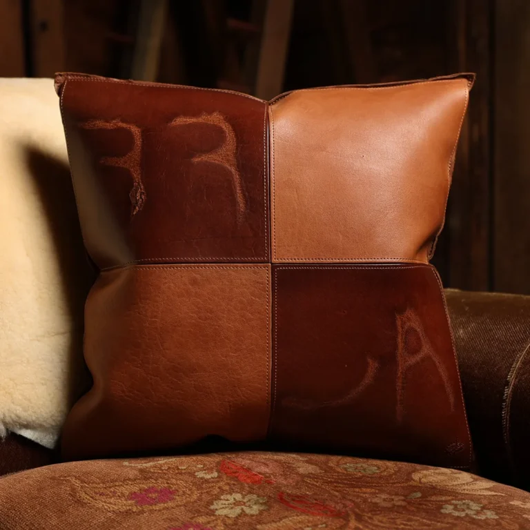 front side of a branded leather pillow