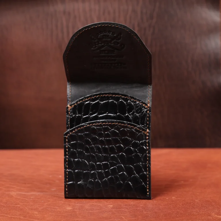 Front pocket wallet with flap in brown American Alligator - front view - 001 - on wood table with a dark background