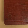 stamp side of colonel littletons private stock journal with a rugged leather