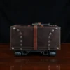 no 3 travel trunk in american buffalo - showing the bottom with a dark background on wood table