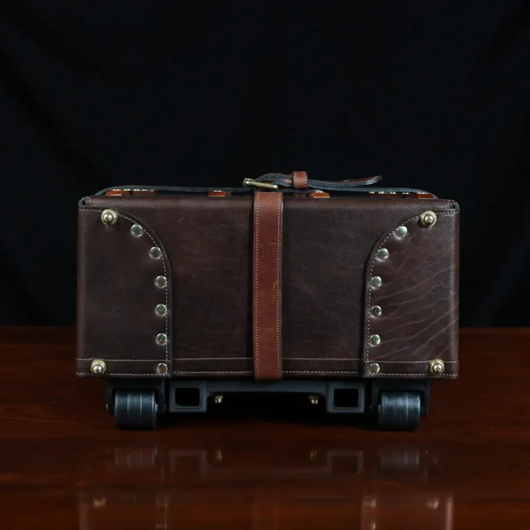 no 3 travel trunk in american buffalo - showing the bottom with a dark background on wood table