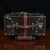 no 3 travel trunk in american buffalo - showing the top with a dark background on wood table