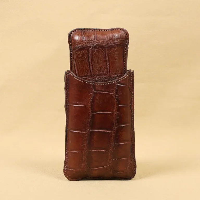 A leather Cigar Case in American Alligator showing the back with brass hardware - id 001