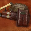 A leather Cigar Case in American Alligator showing the front with brass hardware - id 001