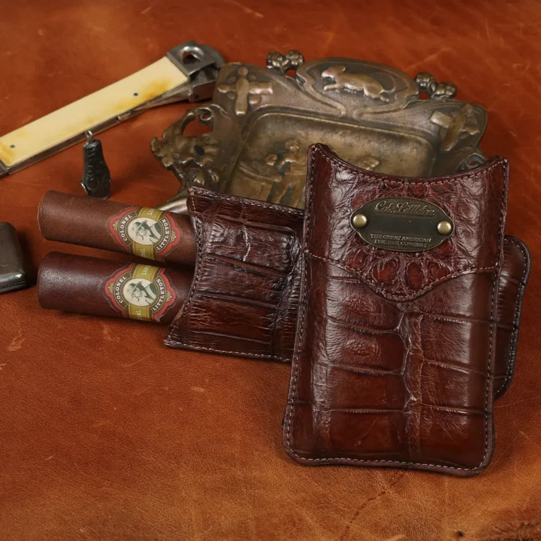 A leather Cigar Case in American Alligator showing the front with brass hardware - id 001