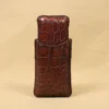 A leather Cigar Case in American Alligator showing the back with brass hardware - id 002