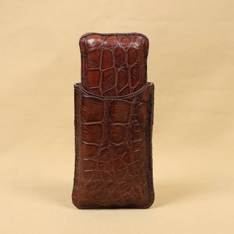 A leather Cigar Case in American Alligator showing the back with brass hardware - id 002