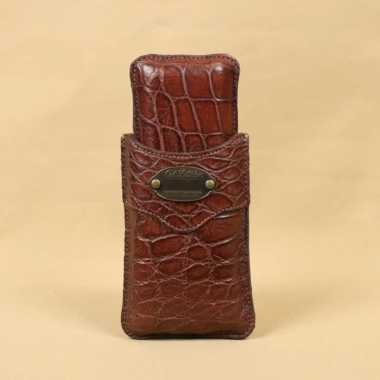 A leather Cigar Case in American Alligator showing the front with brass hardware - id 002