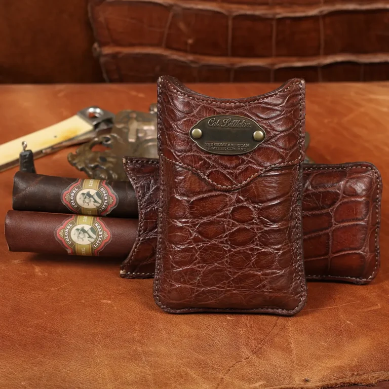 A leather Cigar Case in American Alligator showing the front with brass hardware - id 002