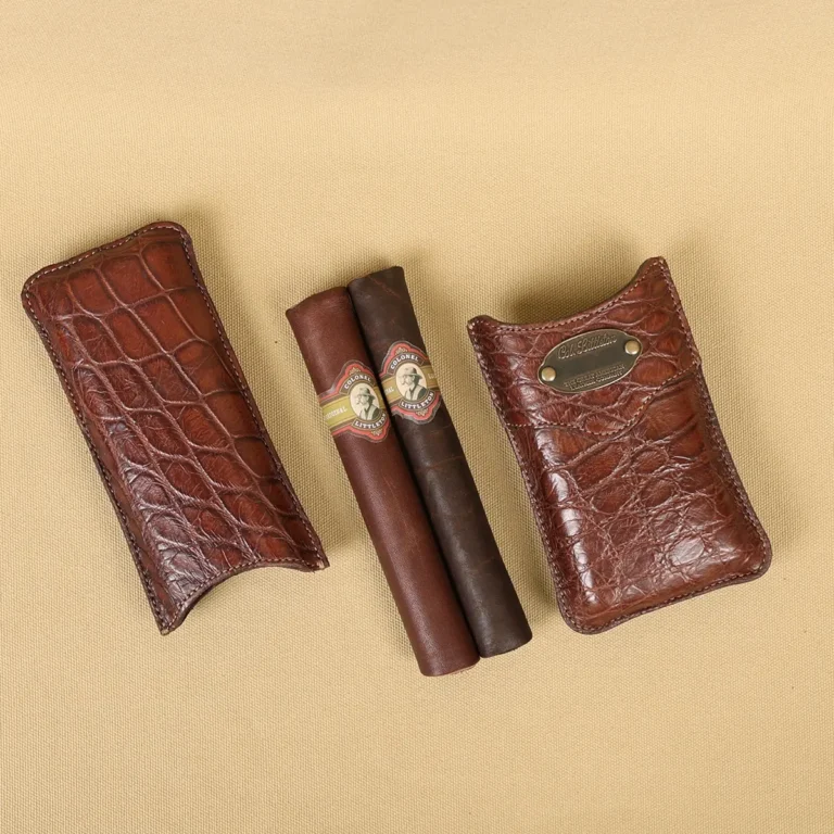 A leather Cigar Case in American Alligator showing the front with leather cigars with brass hardware - id 002