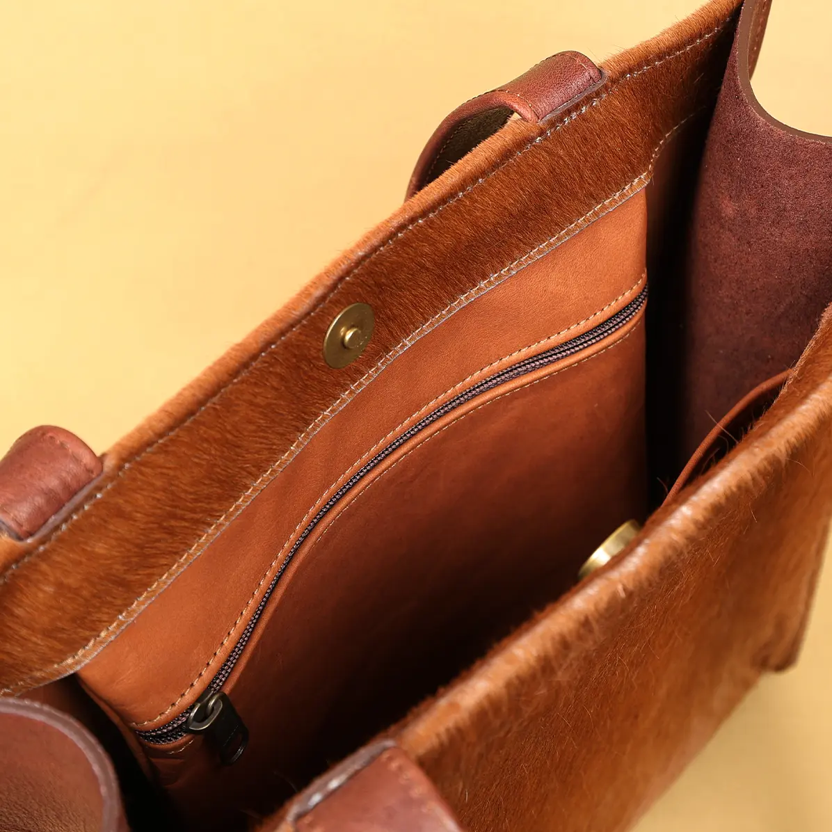 View larger image of open view of the hair on hide tote with a branded patch