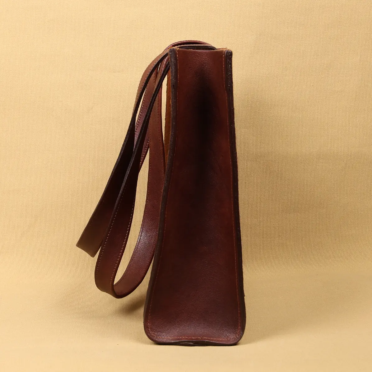 View larger image of side view of the hair on hide tote with a branded patch