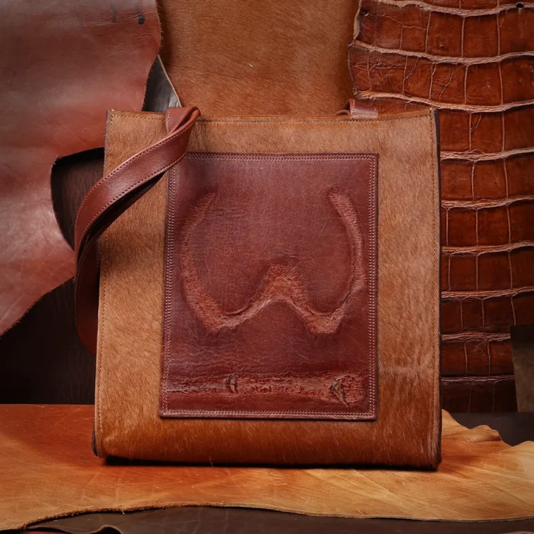 front side of the hair on hide tote with a branded patch
