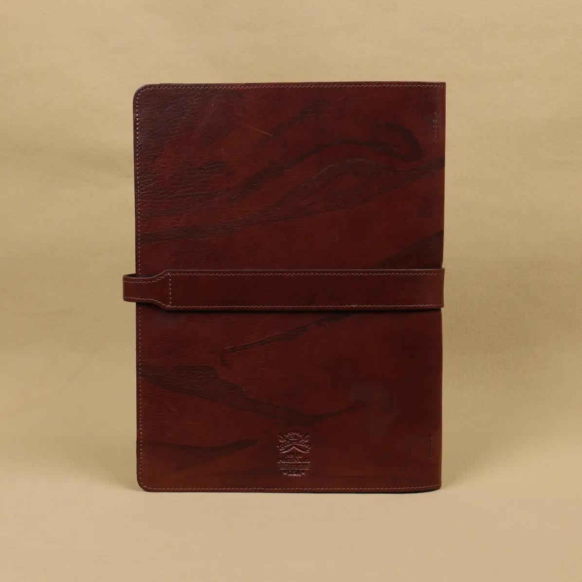 View larger image of Rugged leather portfolio showing the front with brass hardware.