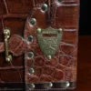 pommel shield view of the American Alligator travel trunk