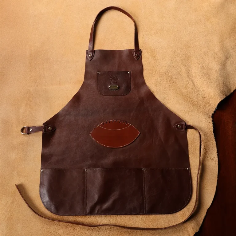 a leather apron with a football patch sewn on the front center