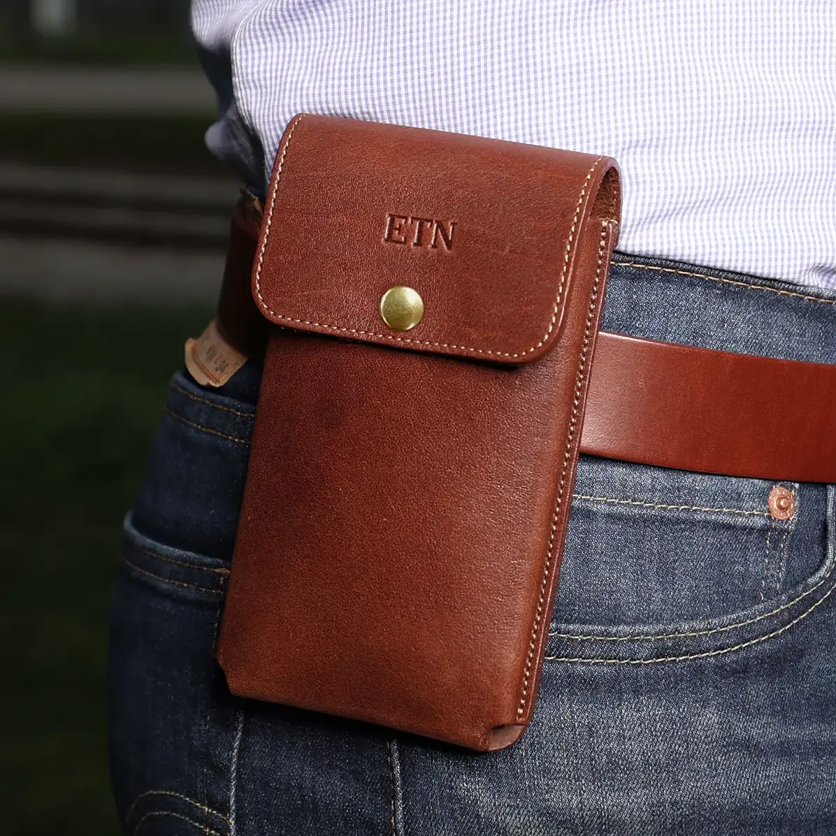 View larger image of phone holster in vintage brown on a man belt
