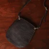 Plain bella bag - showing the front on a wood table