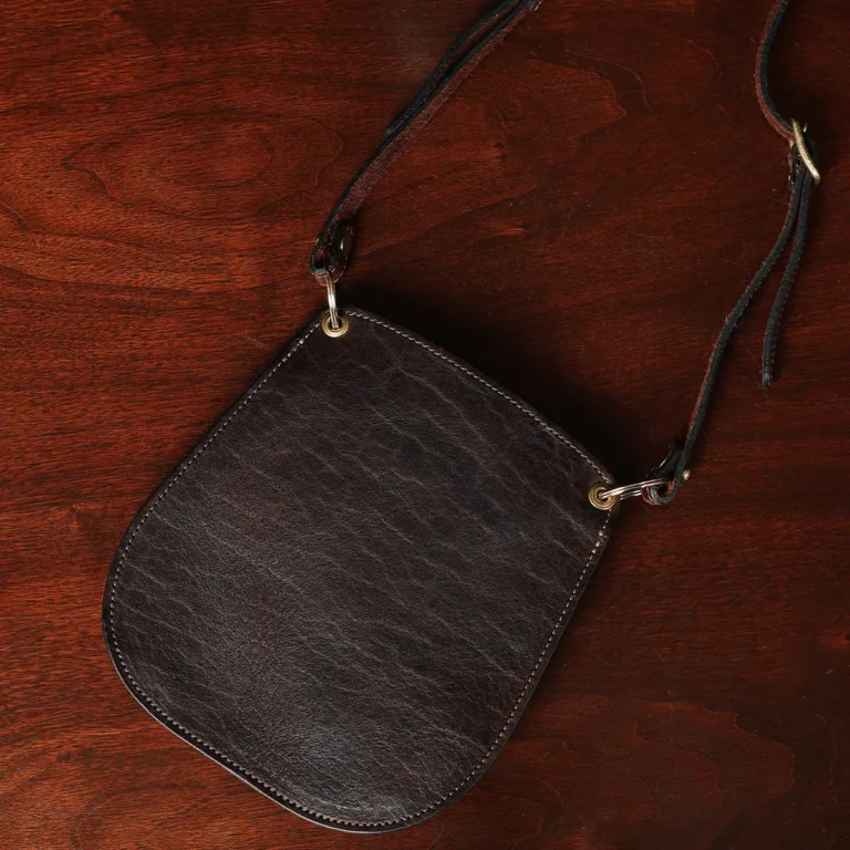 Plain bella bag - showing the front on a wood table