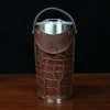 No. 20 Traveler Tumbler Sleeve Set in American Alligator with Steerhide Trim - 20oz stainless steel tumbler - ID 001 - front view on a black background