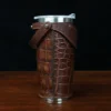 No. 20 Traveler Tumbler Sleeve Set in American Alligator with Tobacco Brown American Buffalo Trim - 20oz stainless steel tumbler - ID 001 - side view on a black background