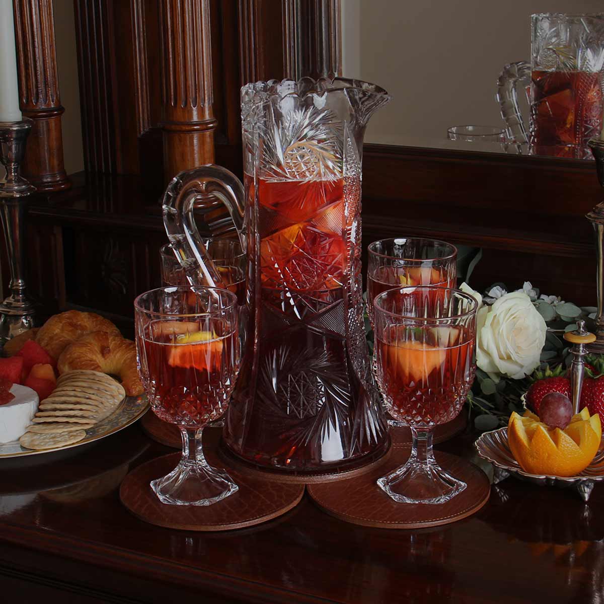 View larger image of leather centerpiece with glasses and pitcher