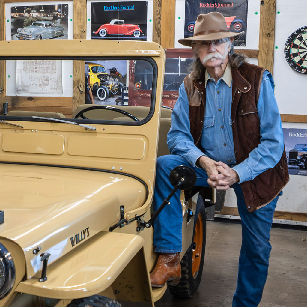 Colonel stands with his restored Willys Jeep